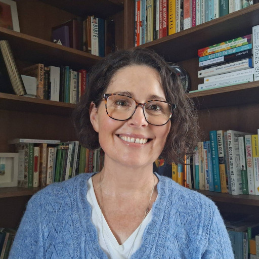 Tovie smiling in front of corner library nook